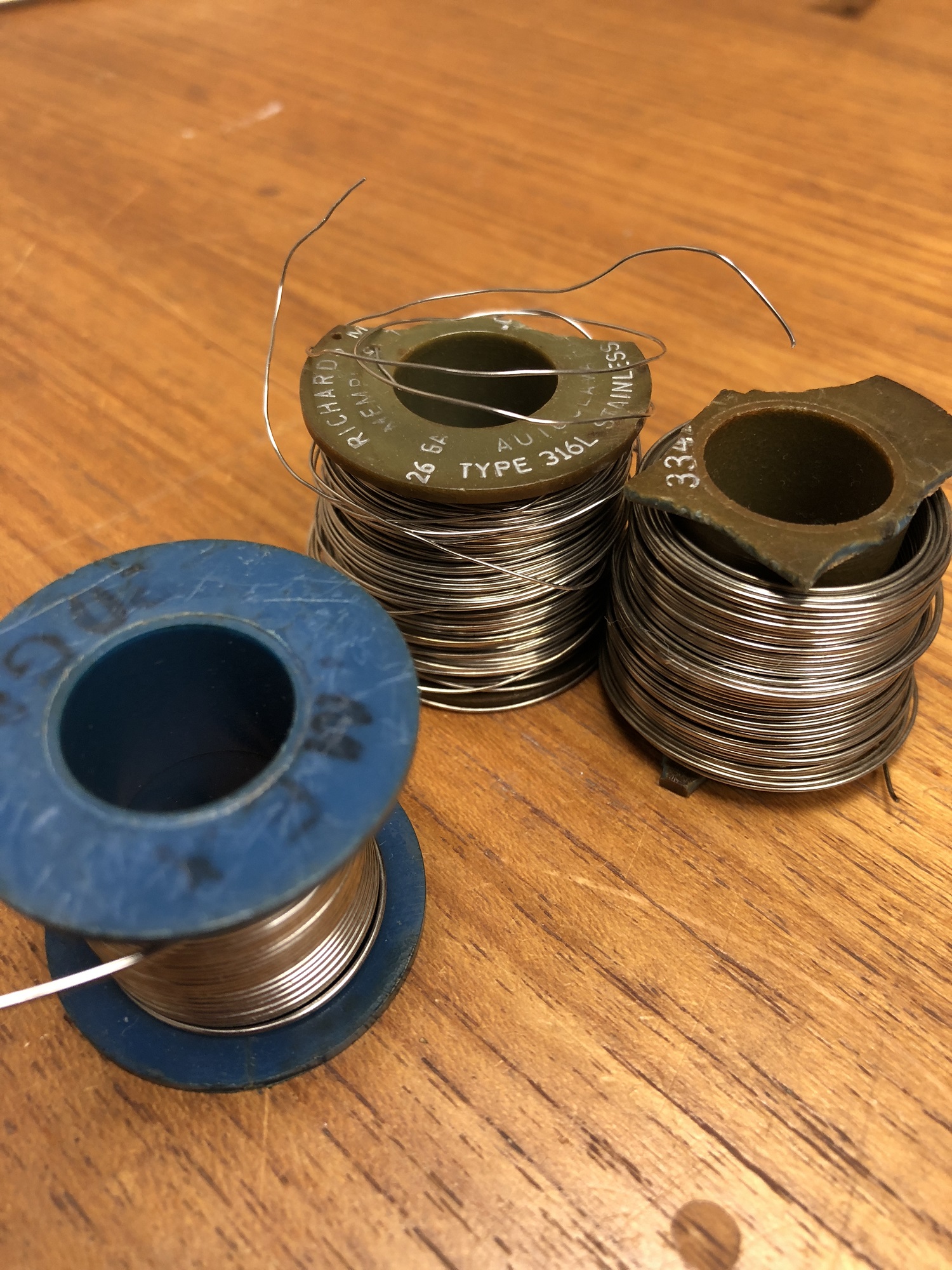 Three Partial Spools of Stainless Wire